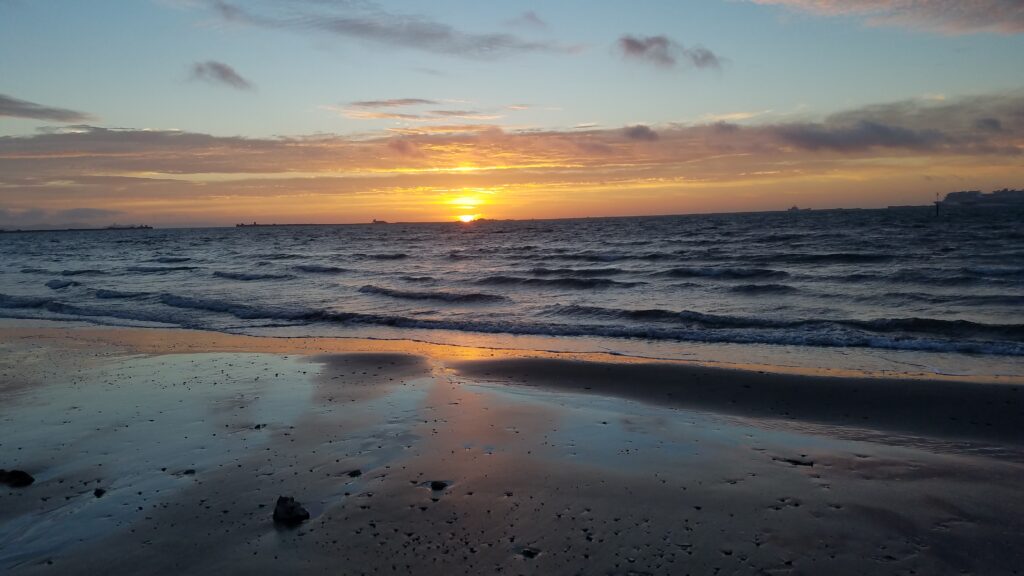 Glorious sun rising Sandsfoot Beach