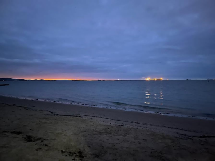 A ship lit up in the dawn, Sandsgoot Beach Weymouth